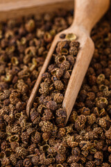 fragrant Sichuan pepper on white acrylic background