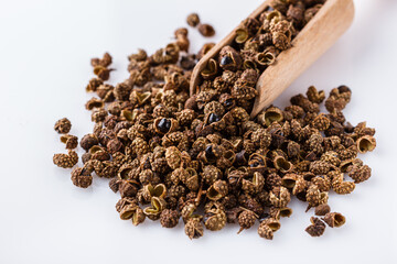 fragrant Sichuan pepper on white acrylic background