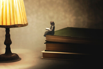 moment of relaxation for a woman who reads a book in her room