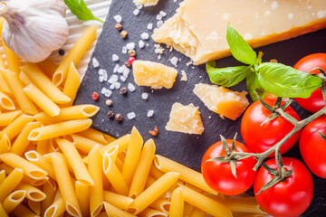concept of traditional italian pasta with tomatoes and basil