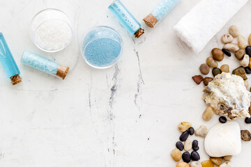 Obraz na płótnie Canvas Spa set bar of sea cosmetics - aroma oil and blue salt. Above view