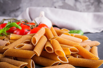 concept of traditional italian pasta with tomatoes and basil