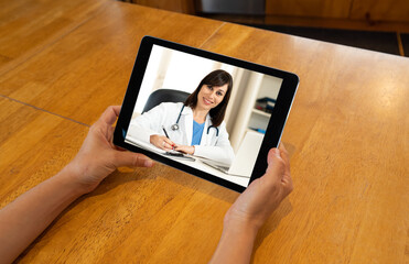 COVID-19 Online medical care. Patient video calling online doctor in virtual medical consultation