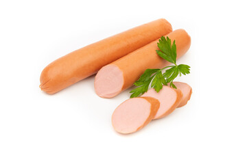 Raw sausages lie in a group on a white background and are decorated with parsley leaves.