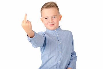 Calm school boy shows rude gesture on a white background