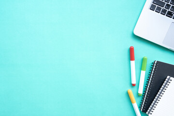 Flat lay,Top view office table desk. Workspace with office tools ,laptop,notebook on the pastel green background.Copy Space for text,Empty Blank to word.Business Finance,Education Technology Concept.