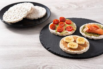 Assortment Puffed rice cake snack on white wooden table