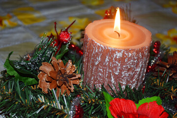 Christmas wreath with candle on the festive table