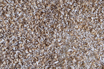 Full frame photo of grinded malted barley for making craft beer
