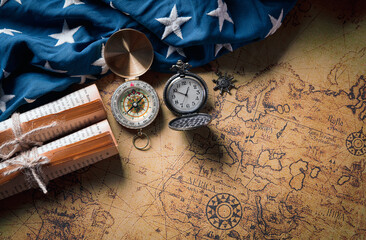 Happy Columbus Day concept. Vintage American flag with compass and retro treasure manuscript.  Flat lay, top view with copy space.