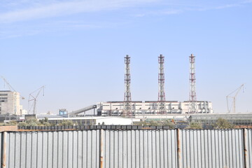 Fototapeta premium factory, industry, power, plant, chimney, industrial, pollution, energy, sky, refinery, smoke, pipe, oil, gas, environment, station, chemical, electricity, building, tower, technology, fuel, blue, pow