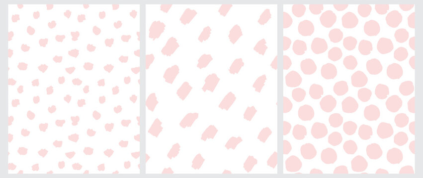 Cute Pastel Color Geometric Seamless Vector Patterns. Light Pink Hand Drawn Polka Dots and Spots on a White Background. Lovely Infantile Irregular Doodle Print.