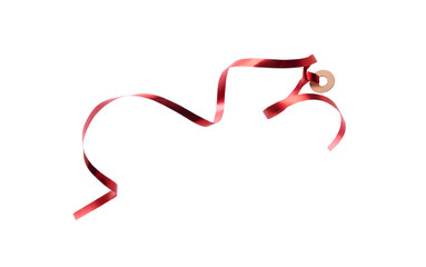 A thin curly red ribbon for Christmas and birthday present tag loop isolated against a white background.
