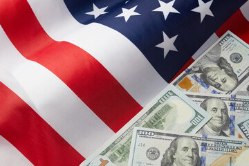 Close up of american flag and dollar cash money. Dollar banknote and United States flag background. Economy of USA