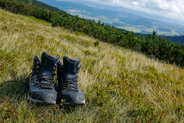 hiker boots on the mountain meadow