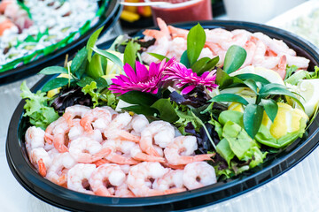 healthy shrimp food on black round platter for buffet event