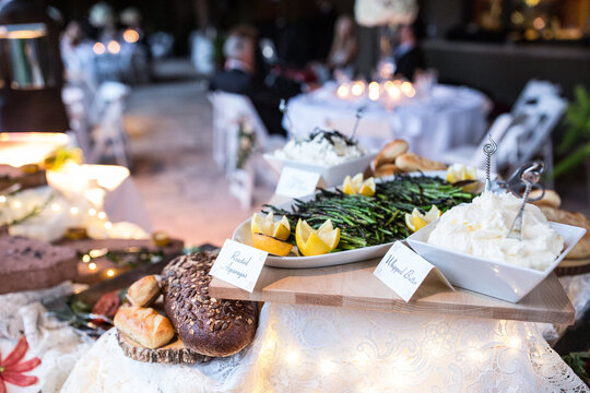variety of buffet foods with name tags