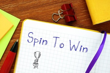 Spin To Win phrase on the piece of paper.