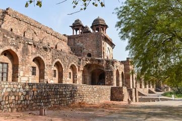 Fototapeta premium A mesmerizing view of architecture of small tomb at old fort from side lawn.