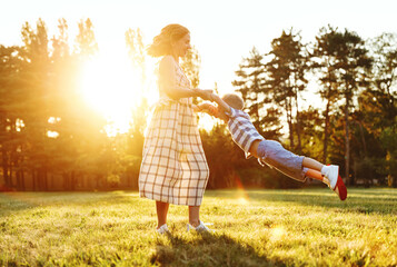 Happy family: mother and son in nature in summer.