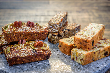 Healthy seeded protein bars with nuts are arranged on display