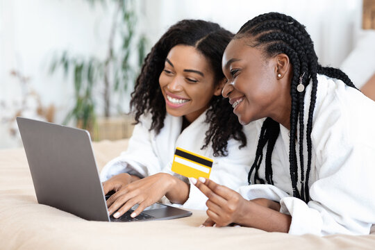 Two black besties shopping online at home