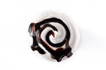 Chocolate iced milkshake isolated on white background. Top view