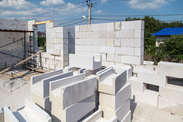 Fototapeta premium Construction of the walls of the house from foam concrete bricks.