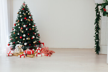 Decorated room with beautiful Christmas tree and gifts