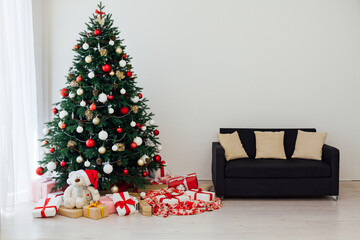 Decorated room with beautiful Christmas tree and gifts