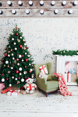Decorated room with beautiful Christmas tree and gifts