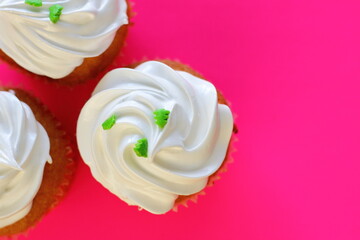 Cupcake decorated by cream meringue and sweet Christmas tree, dessert for party, birthday, new year eve, festive
