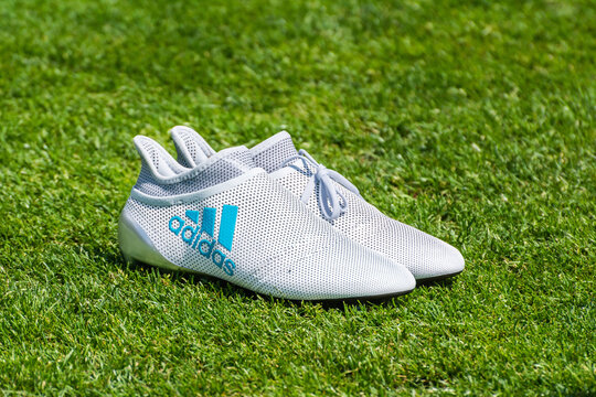 Neustift Im Stubaital, Austria – May 31, 2017. White Adidas Football Boots On Green Grass.