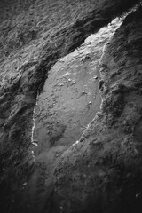 Natural sand texture of the beach. Brands made by water flowing through the sand of the beach. Abstract photography sand textures, abstract naturalism, from the abstract to the figurative.