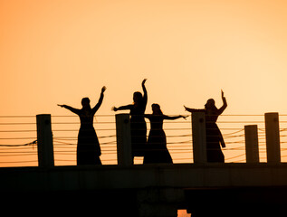 Georgian dancing on the pier in sunset