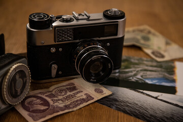 Vintage photo camera with old banknotes
