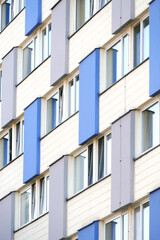Blue and white facade of a large apartment building