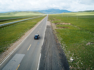 Car running on high altitude trail