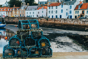 Lobster Pots on the Harbour overlooking the Shore Houses