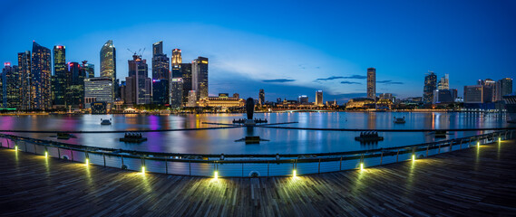 Ultra wide panorama of Cityscape of Singapore Marina bay area at dusk.