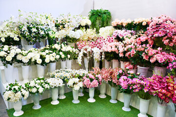 Colorful bouquets of flowers on showcase of flower shop