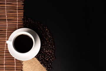 warm cup of coffee on brown background
