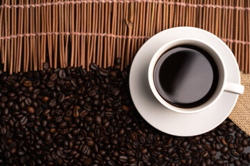 warm cup of coffee on brown background