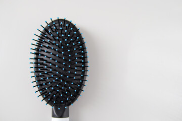 Comb after use Hair stuck On a white background top view