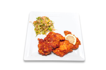 Steak Schnitzel with lemon isolated on white background