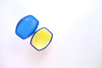 top view of petroleum jelly .in a container on white background 
