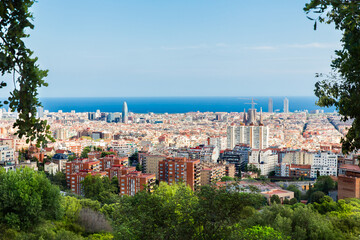 Fototapeta na wymiar Barcelona, Catalonia, Spain, September 21, 2019. The view of Barcelona from the Park of Guell was designed by the architect Antoni Gaudi.