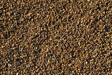 Drainage systems from small pebbles. Garden drainage for plants and trees. Yellow stones for roads and flower beds.