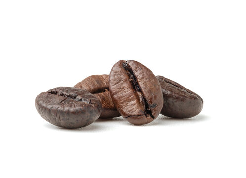 Group of fresh roasted dark brown arabica coffee beans isolated on a white background with clipping path.