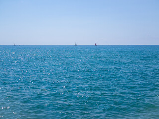 Panoramic view of sea skyline, sails on horizon, minimalistic style, copy space